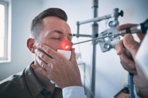 doctor looking at patients nose