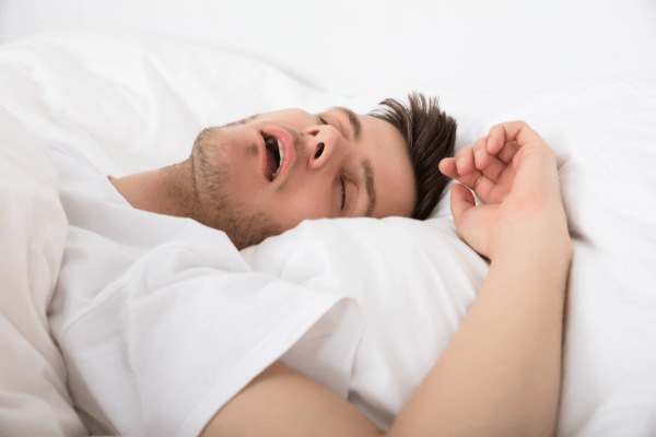 man sleeping with mouth open