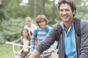 family riding bikes outdoors