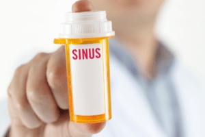 doctor holding sinus medication