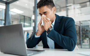 Young Man experiencing sinus pain.