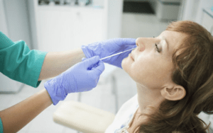 Young woman experiencing sinus pain.